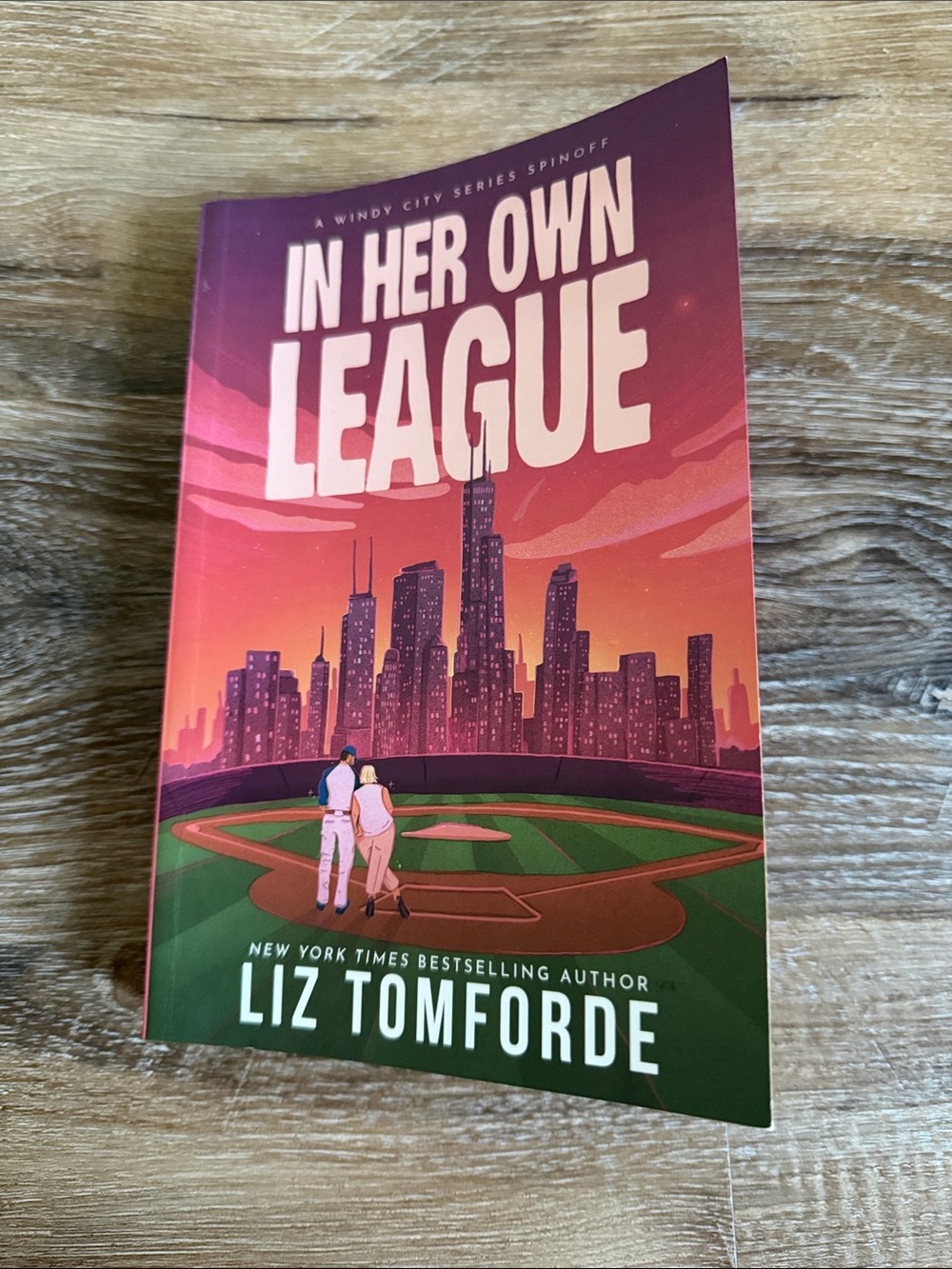 "In Her Own League" - Liz Tomforde Pink and Orange Paperback